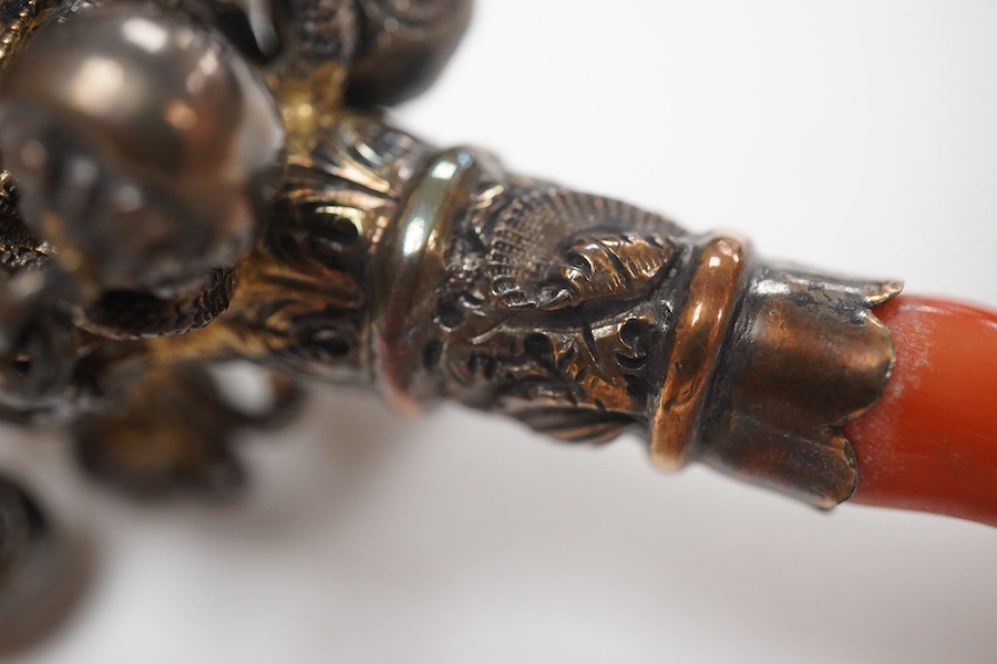 A late George III silver gilt and coral mounted child's rattle, London, 1817, 14.2cm. Condition - poor to fair